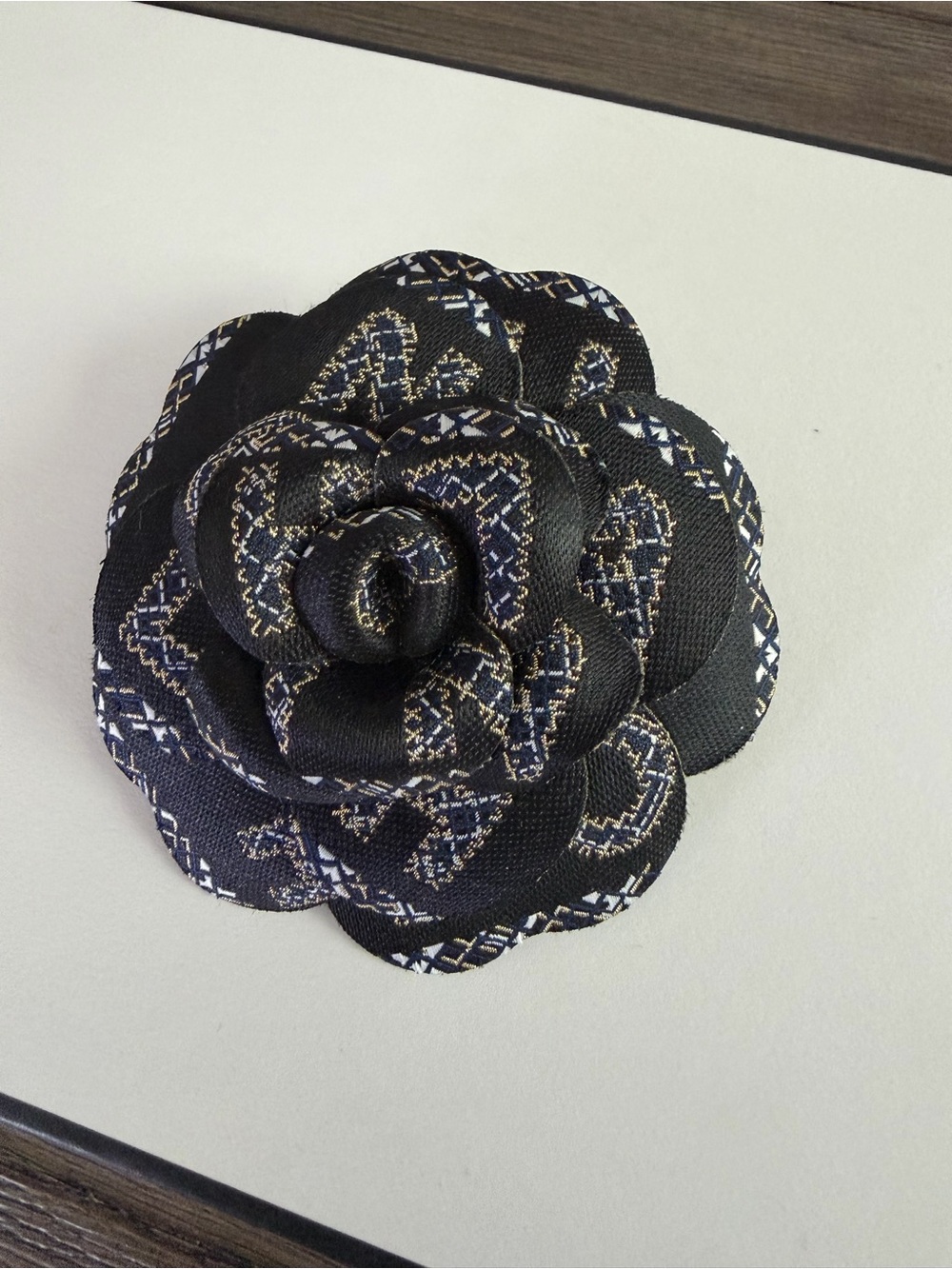 CHANEL Black Fabric Camellia with White and Gold Accents - Picture 3 of 4